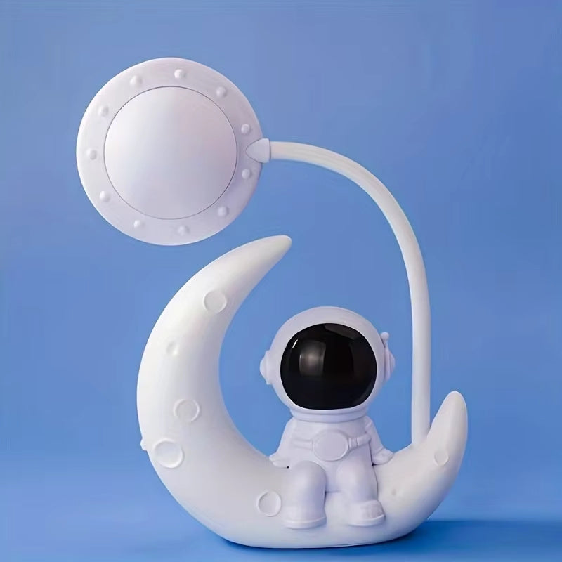 Small desk lamp with moon and astronaut design