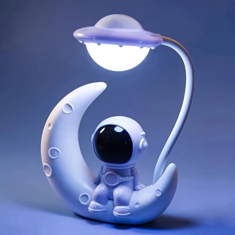Small desk lamp with moon and astronaut design