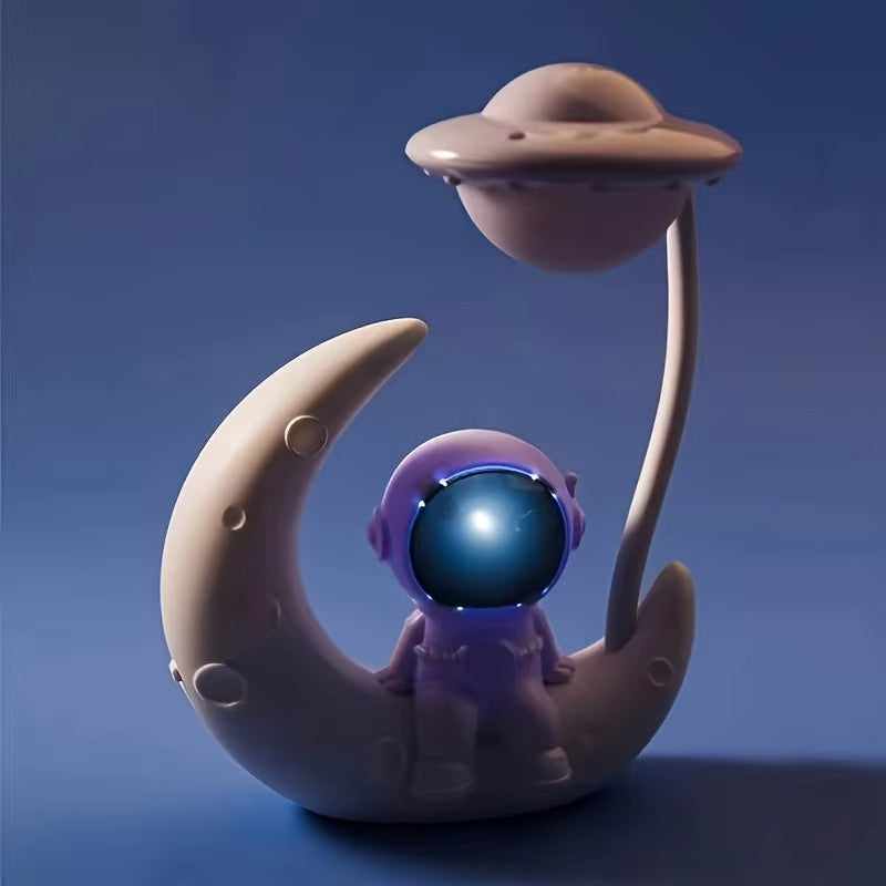 Small desk lamp with moon and astronaut design